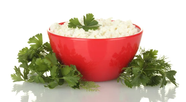 Cottage cheese with parsley and dill in red bowl isolated on white — Stock Photo, Image