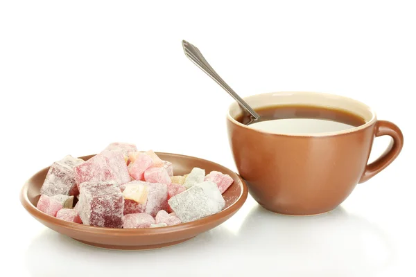 A cup of tea and saucer with delicious turkish delight isolated on white — Stock Photo, Image