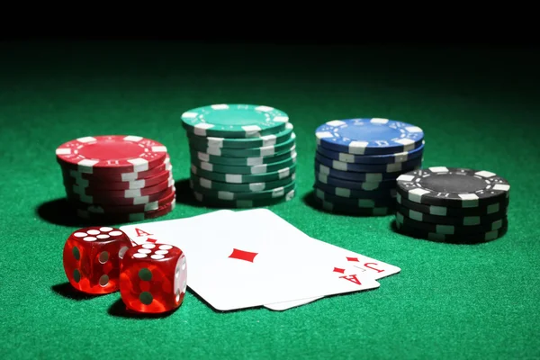 Cards and chips for poker on green table — Stock Photo, Image