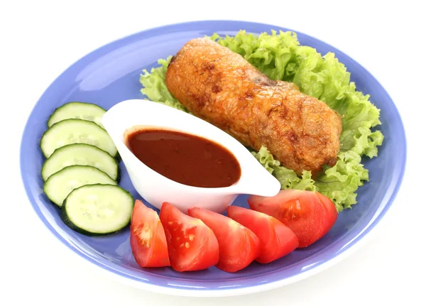 Tasty meat cutlet with garnish on plate isolated on white