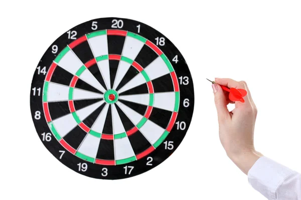 Dart in hand and dartboard isolated on white — Stock Photo, Image
