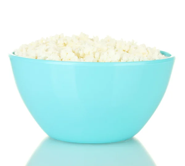 Cottage cheese in blue bowl isolated on white — Stock Photo, Image