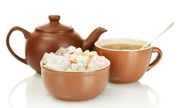 stock image Teapot with cup and saucer with sweet turkish delight isolated on white