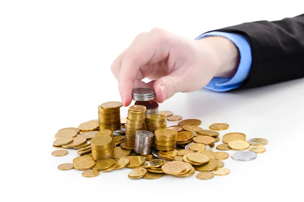 Biznesmen ręcznie umieścić monety na białym tle — Zdjęcie stockowe
