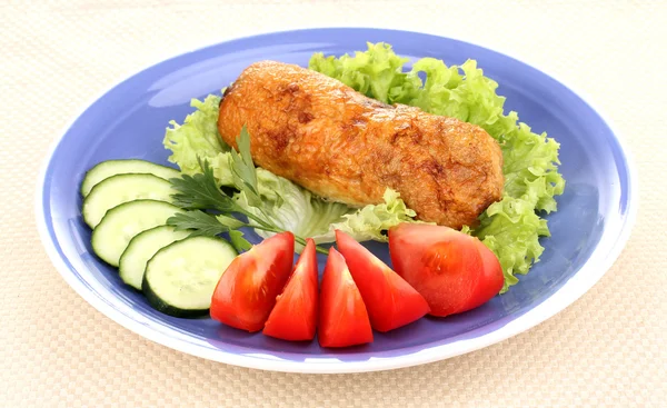 Tasty meat cutlet with garnish on plate — Stock Photo, Image
