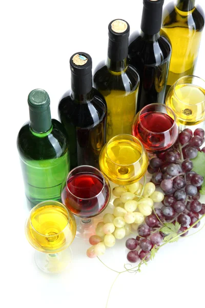 stock image Bottles and glasses of wine and ripe grapes isolated on white