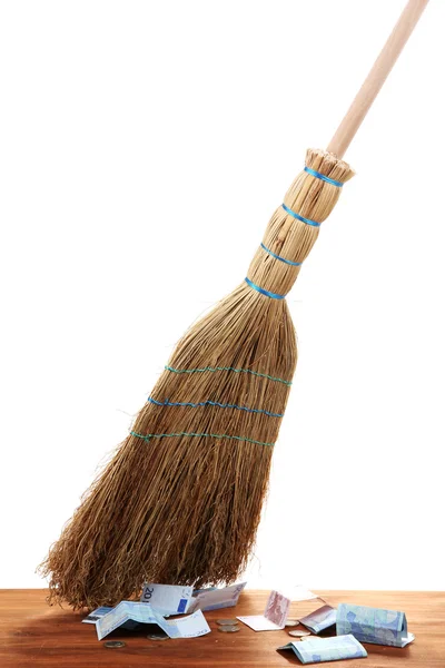 Broom sweep the euro on white background close-up — Stock Photo, Image