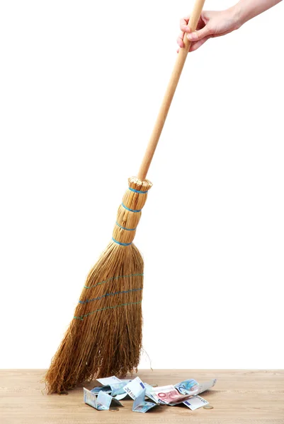 Broom sweep the euro on white background close-up — Stock Photo, Image
