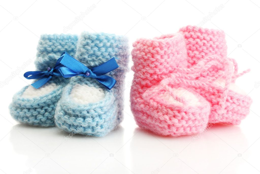 Pink and blue baby boots isolated on white