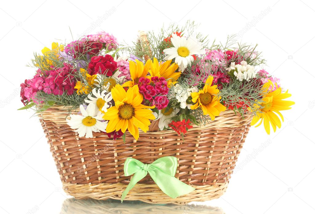 Beautiful bouquet of bright wildflowers in basket, isolated on white