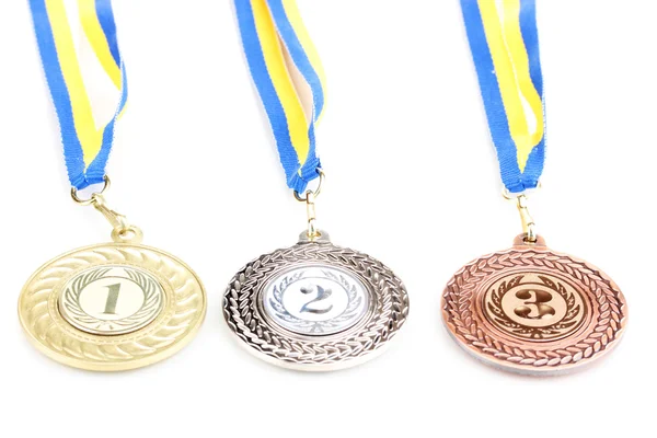 Tre medaljer isolerad på vit — Stockfoto
