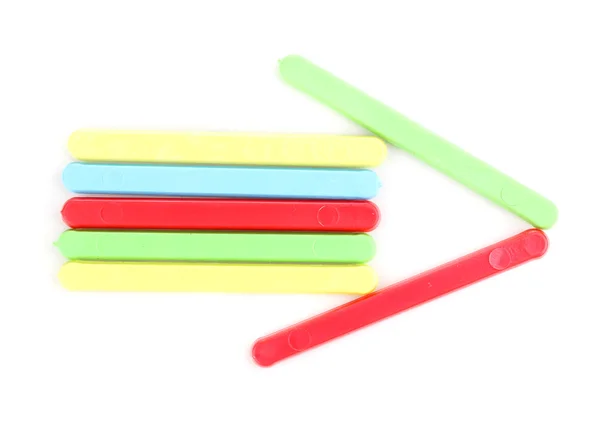 Цветные палочки сформированные стрелки изолированы на белом — стоковое фото