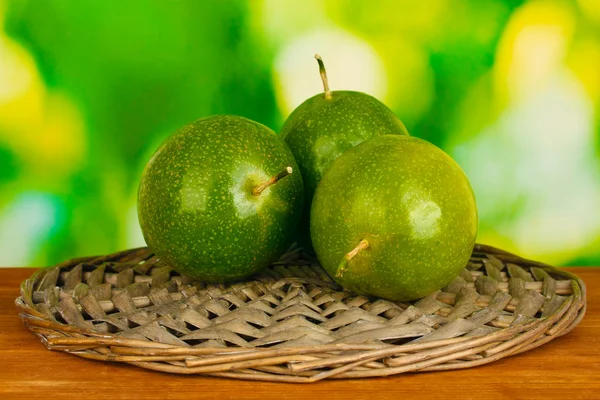 Green passion fruit on green background — Stock Photo, Image