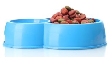 Dry dog food and water in blue bowl isolated on white clipart