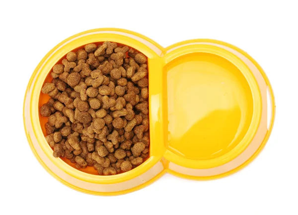 stock image Dry cat food and water in yellow bowl isolated on white