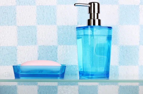 Bath accessories on shelf in bathroom — Stock Photo, Image