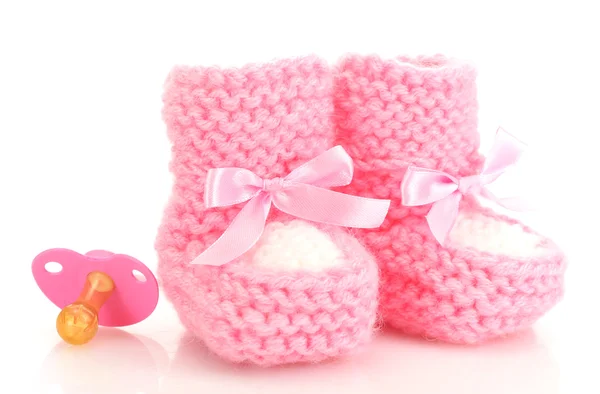 Pink baby laarzen en fopspeen geïsoleerd op wit — Stockfoto