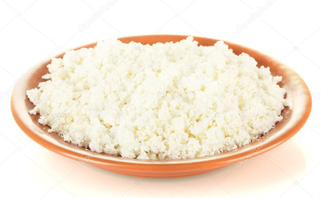 Cottage cheese in a plate isolated on white