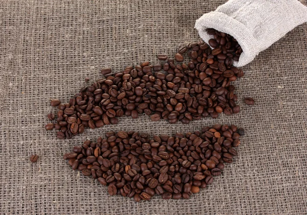 Coffee beans on a sack background — Stock Photo, Image