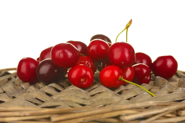 Cherry on the wicker cradle on white background close-up — Stock Photo, Image