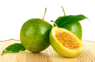 Green passion fruit on white background close-up clipart