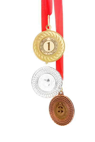 Üç madalya üzerinde beyaz izole — Stok fotoğraf