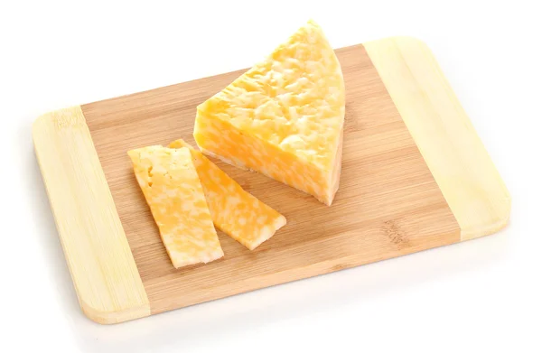 Cheese on cutting board isolated on white — Stock Photo, Image