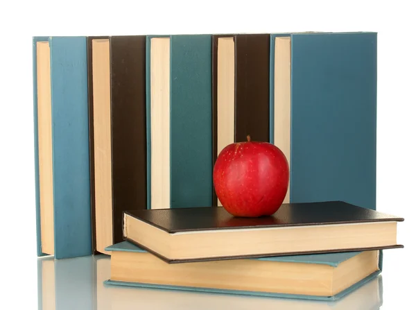 Blauwe en zwarte boeken met appel geïsoleerd op wit — Stockfoto