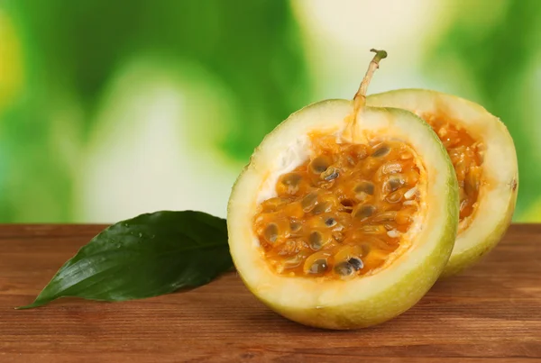 Green passion fruit on bright green background close-up — Stock Photo, Image
