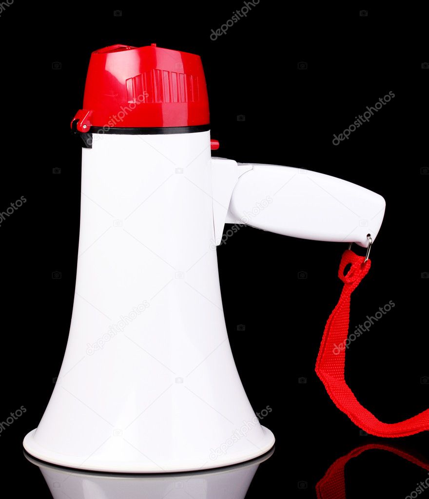 Red and white megaphone isolated on black