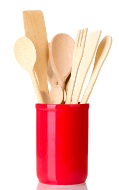 Wooden kitchen utensils in cup isolated on white clipart