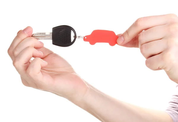 Klíč od auta s šarmem v rukou izolovaných na bílém — Stock fotografie