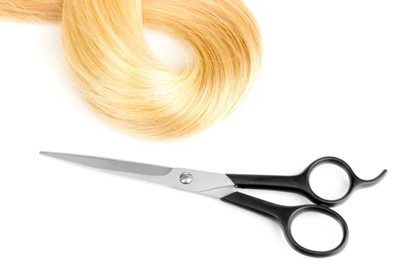 Shiny blond hair and hair cutting shears isolated on white — Stock Photo, Image