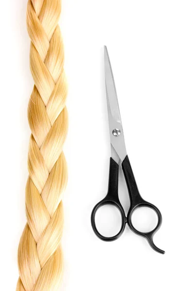 Shiny blond hair braided in pigtail and hair cutting shears isolated on white — Stock Photo, Image
