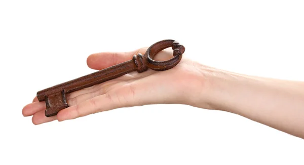 Woman's hand holding an antique key on white background — Stock Photo, Image