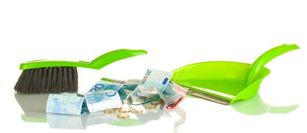 Sweeps money in the shovel on white background close-up — Stock Photo, Image