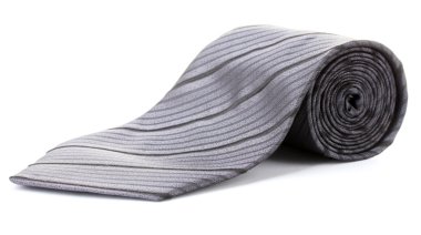 Gray rolled tie isolated on white clipart