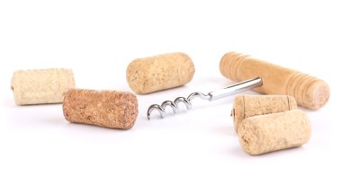 Corkscrew with wine corks isolated on white clipart