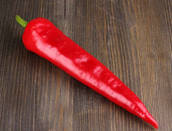 stock image Red hot chili pepper on wooden background