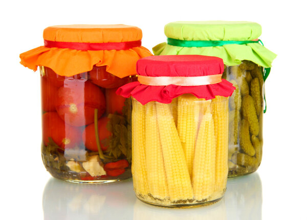 Jars with canned vegetables isolated on white