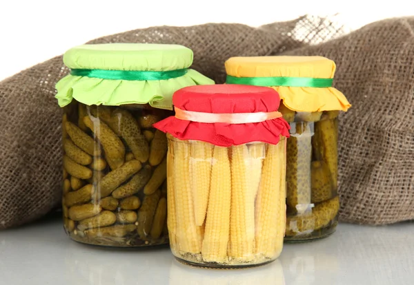 Jars with canned vegetables on canvas background — Stock Photo, Image
