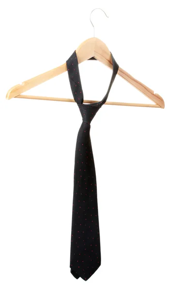 Elegant black tie on wooden hanger isolated on white — Stock Photo, Image