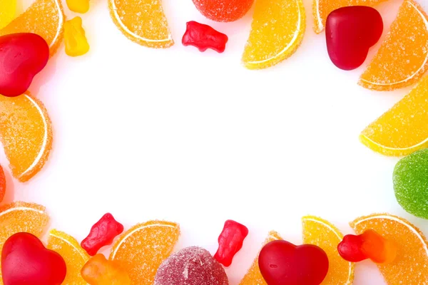 Frame van kleurrijke gelei snoepjes geïsoleerd op wit — Stockfoto