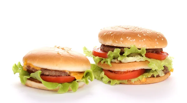 Hambúrguer grande e saboroso e cheeseburger isolado em branco — Fotografia de Stock