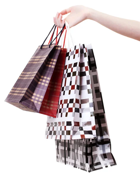 Női kezében fényes bevásárló táskák elszigetelt fehér — Stock Fotó