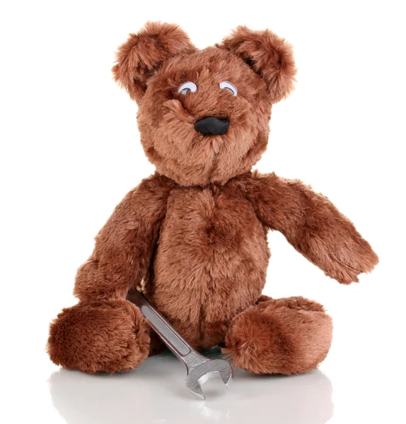 Zittend bear speelgoed met moersleutel geïsoleerd op wit — Stockfoto