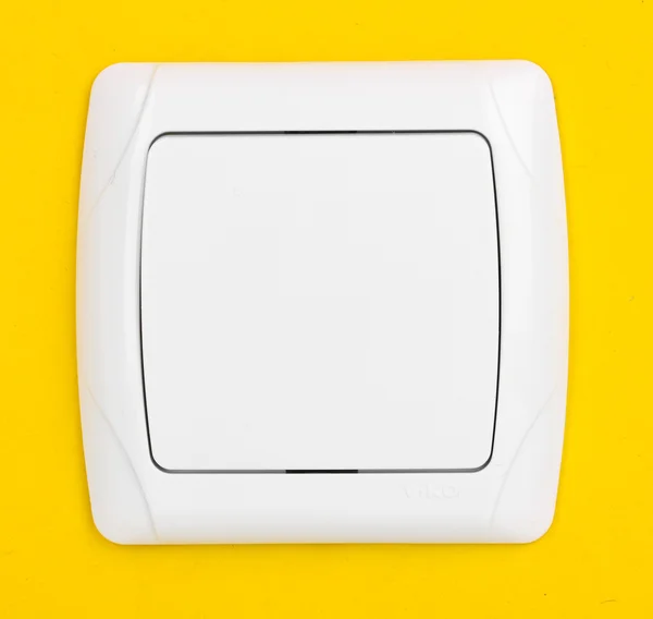 Interruttore di luce moderno su sfondo giallo — Foto Stock