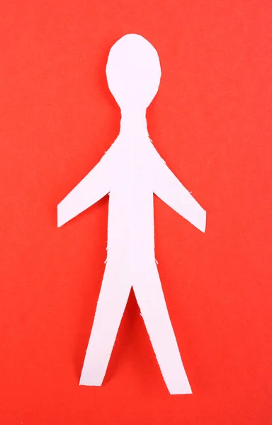 Paper man on red background — Stock Photo, Image
