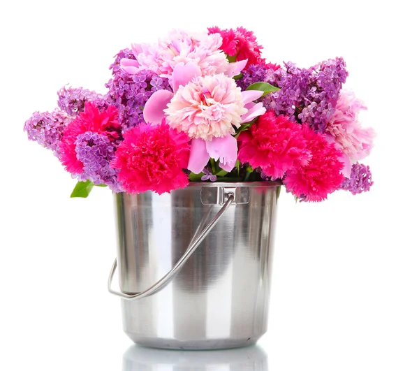 Beautiful spring flowers in metal bucket isolated on white — Stock Photo, Image