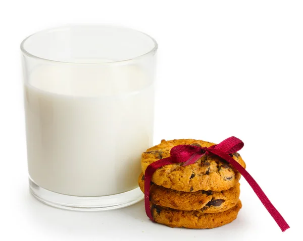 Glass of milk and chocolate chips cookies with red ribbon isolated on white — Stock Photo, Image